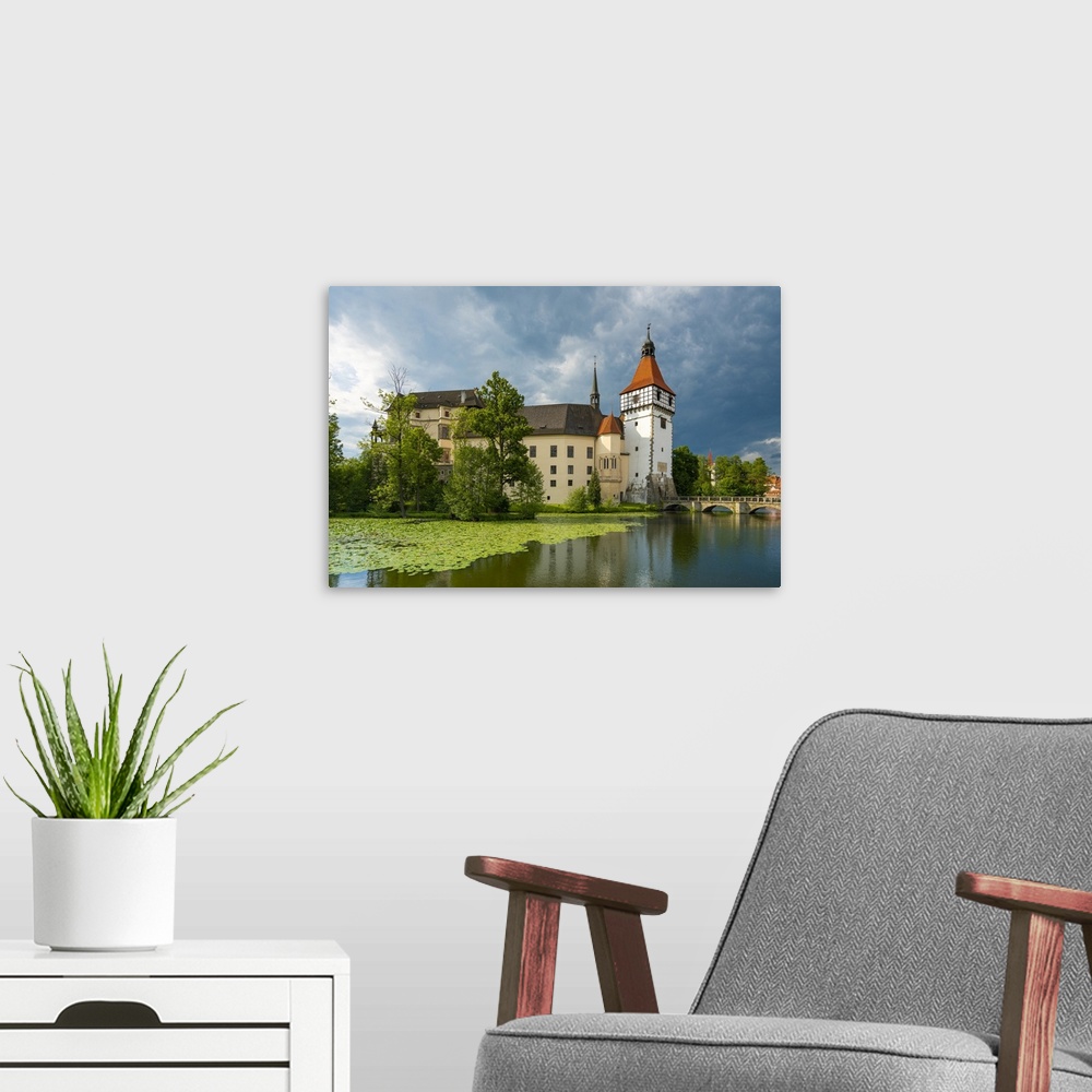 A modern room featuring Reflection of Blatna Castle in pond, Blatna, Strakonice District, South Bohemian Region, Czech Re...