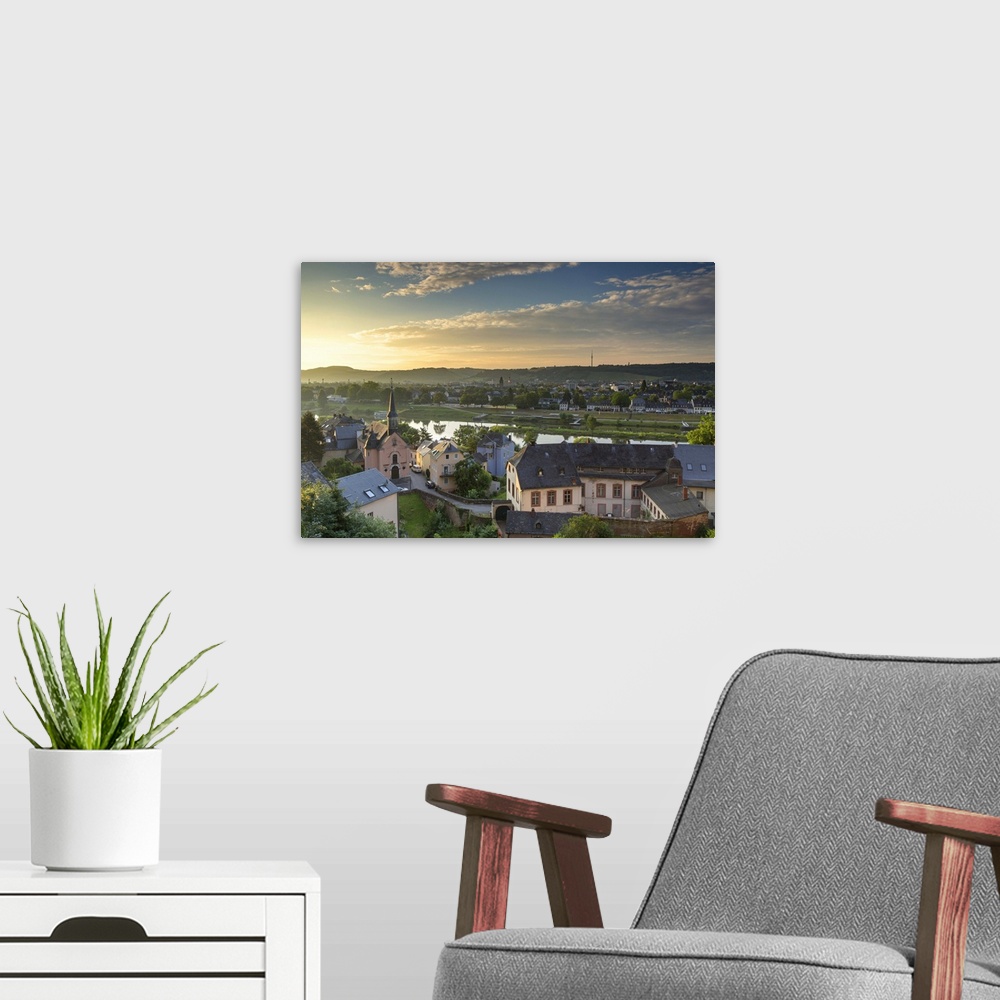 A modern room featuring View of River Moselle and skyline at dawn, Trier, Rhineland-Palatinate, Germany.