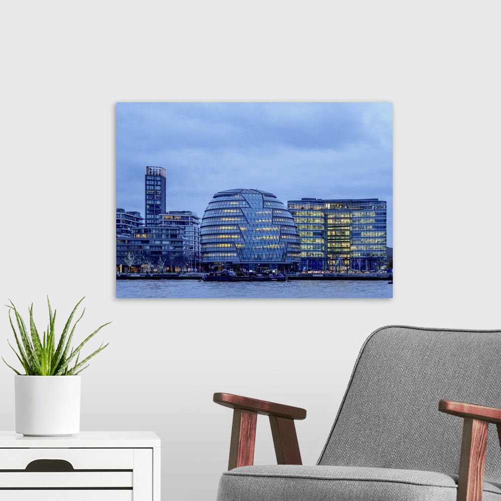 A modern room featuring River Thames and City Hall at twilight, London, England, United Kingdom