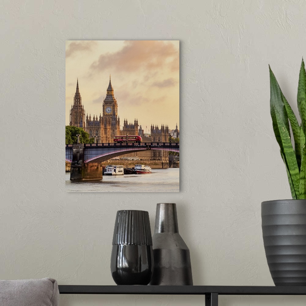 A modern room featuring View over the River Thames towards the Palace of Westminster at sunrise, London, England, United ...