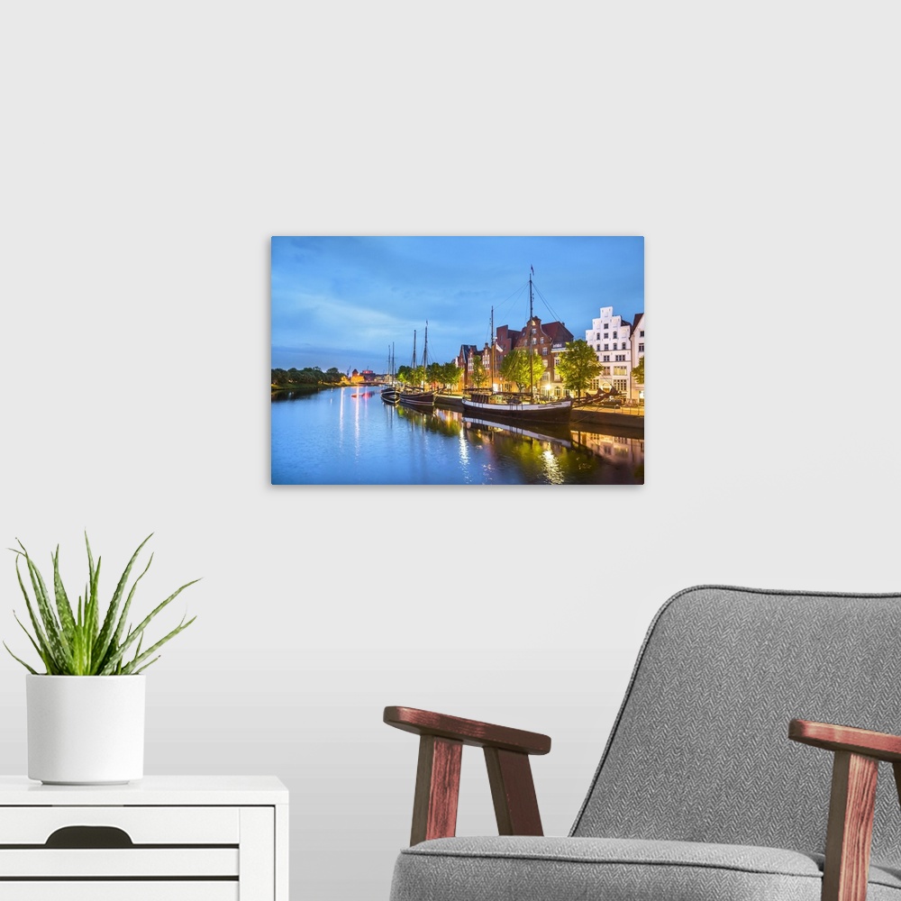 A modern room featuring View over river Trave towards old town, Lubeck, Baltic coast, Schleswig-Holstein, Germany.