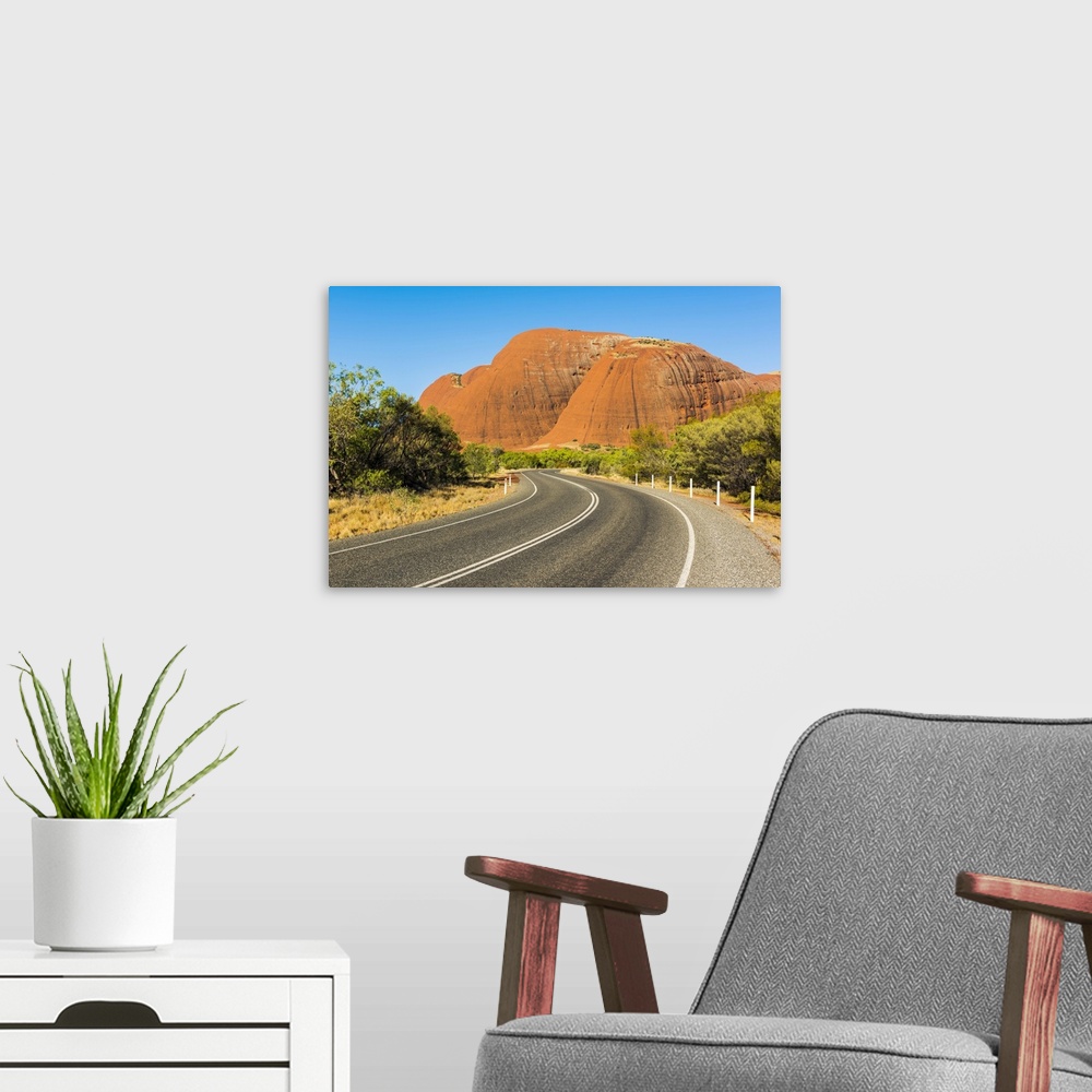 A modern room featuring Uluru-Kata Tjuta National Park, Northern Territory, Central Australia, Australia. Road leading to...