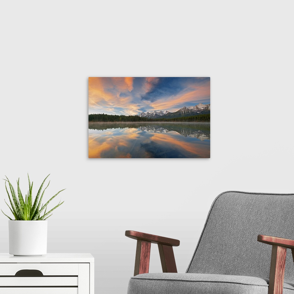 A modern room featuring Clouds and Rocky Mountains reflected in Herbert Lake, Banff National Park, Alberta, Canada