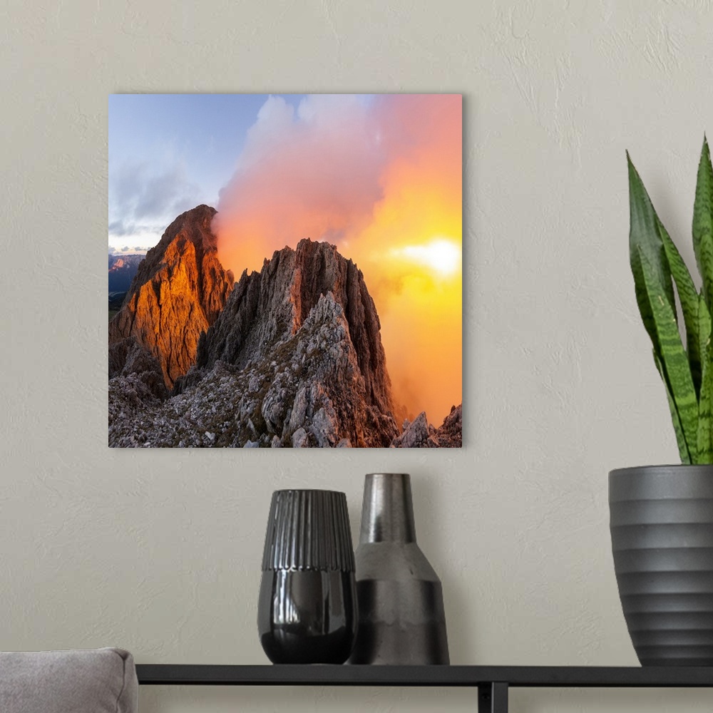 A modern room featuring Cloudy sunset with Roda de Vael peak illuminated and backlight red clouds from the rocks of Vajol...
