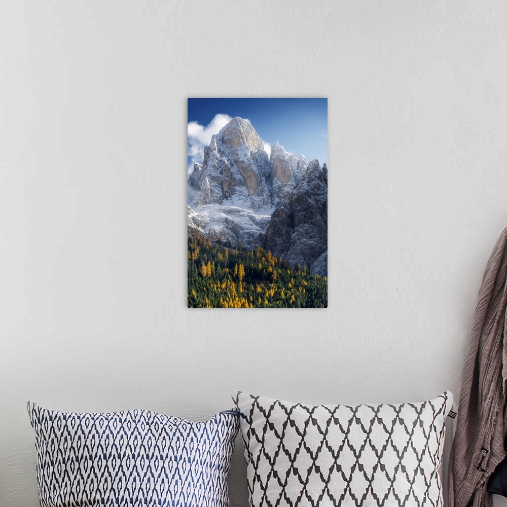 A bohemian room featuring The first snow of the year in late autumn at Rolle Pass, with the majestic Pale di San Martino in...