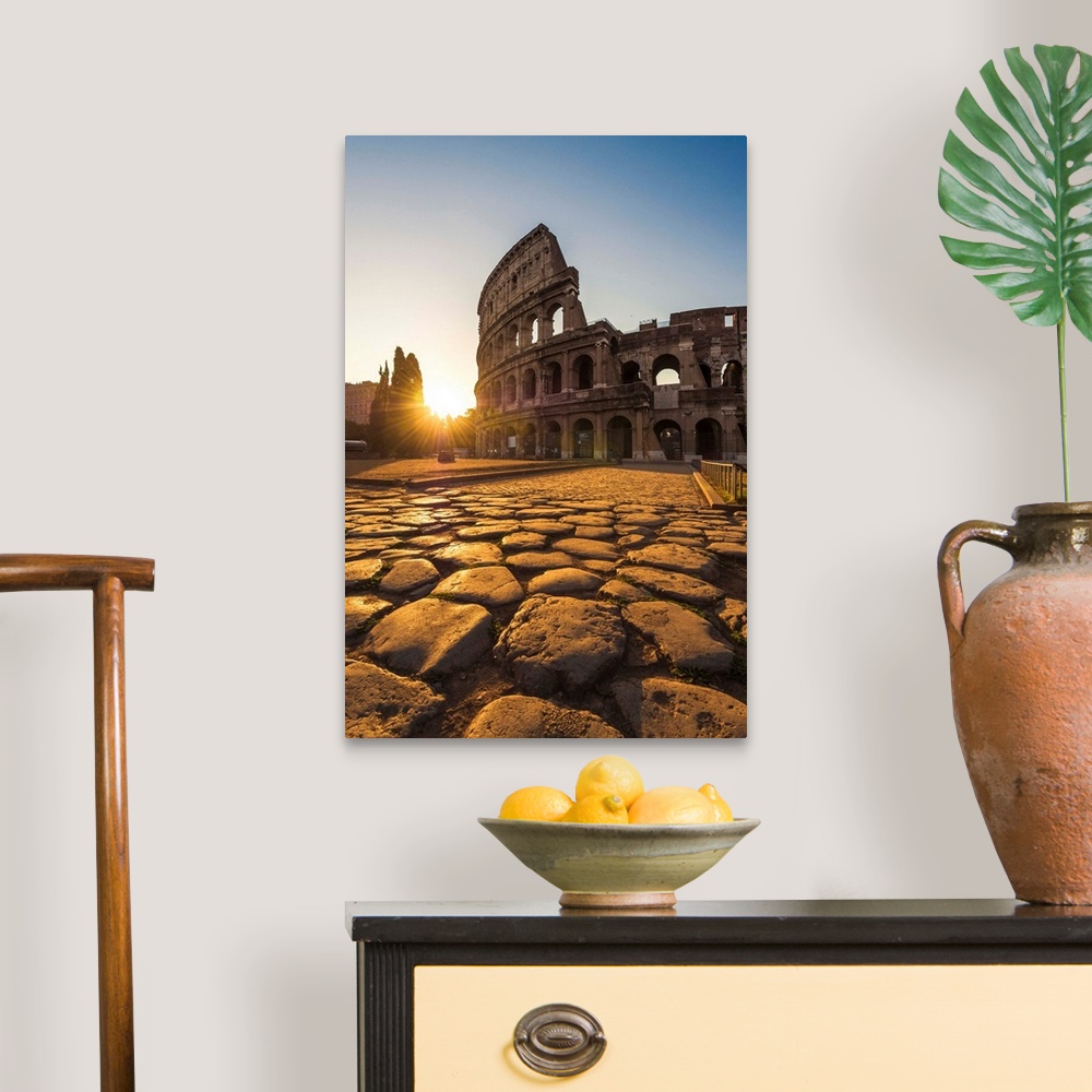 A traditional room featuring Rome, Lazio, Italy. Colosseum at summer sunrise.