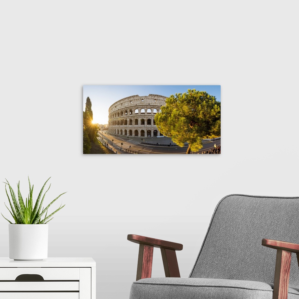 A modern room featuring Rome, Lazio, Italy. High angle panoramic view over the Colosseum square at sunrise.
