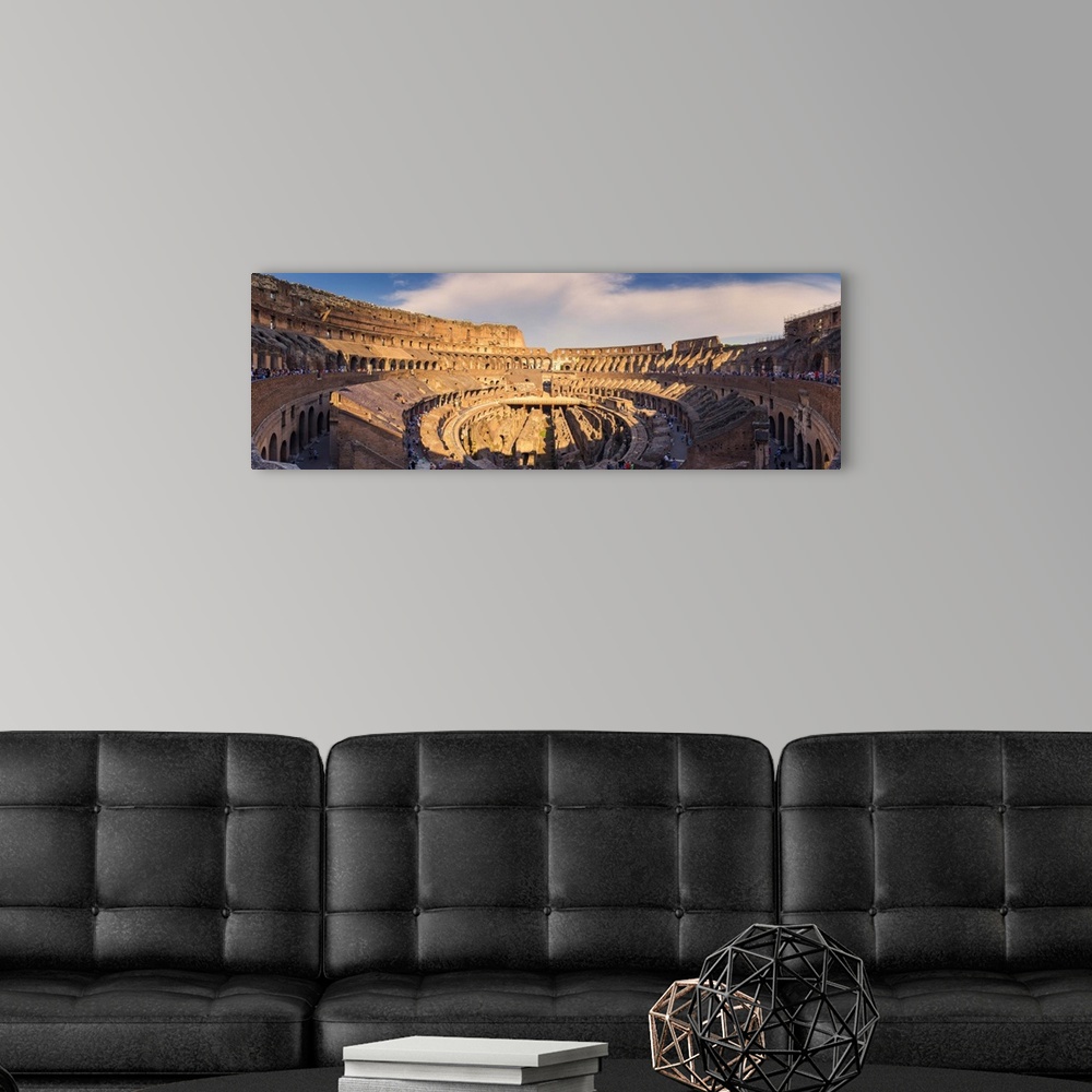 A modern room featuring Rome, Lazio, Italy. Inside the colosseum at sunset.