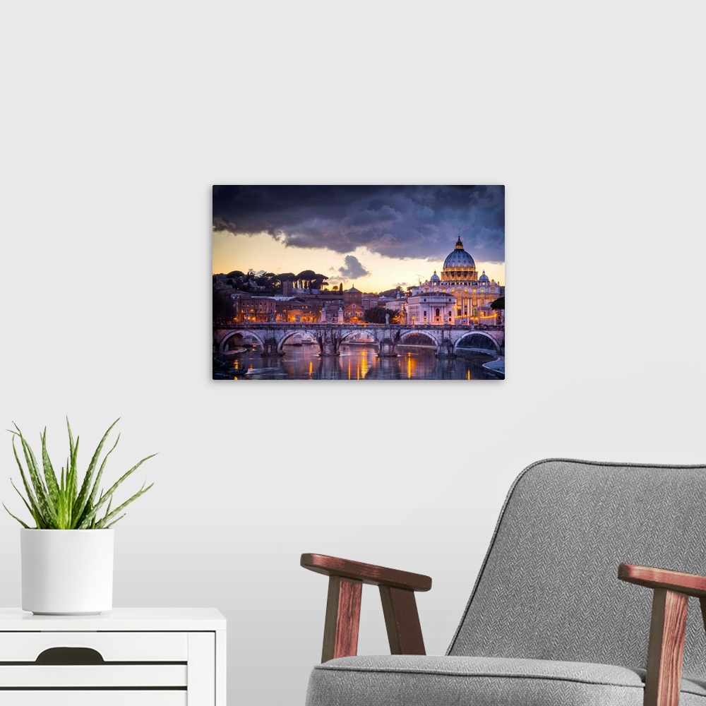 A modern room featuring Rome, Lazio, Italy. Sunset on Tevere River, with Saint Peter Cathedral on the background.