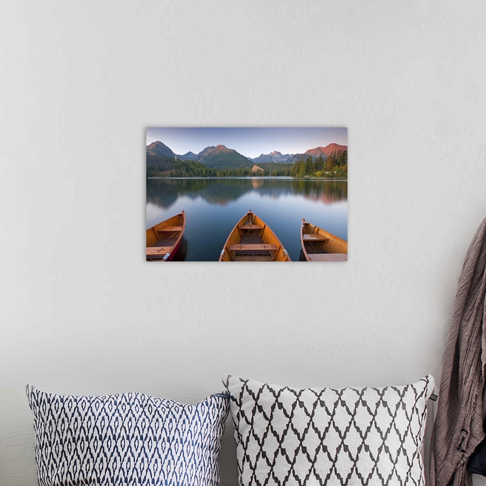 A bohemian room featuring Rowing boats and mountains beneath a twilight sky, Strbske Pleso Lake in the High Tatras, Slovaki...
