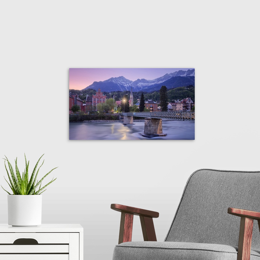 A modern room featuring Sankt Nikolaus district at dusk with the Nordkette mountain range in the background, Innsbruck, T...