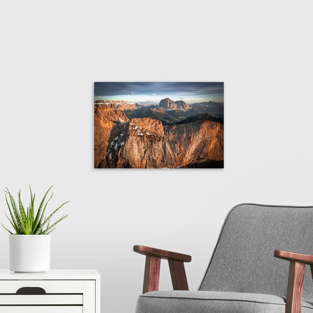 A modern room featuring Aerial view of Sassolungo group, Sassopiatto, Sella, Gardena Valley and Seceda at sunset, Dolomit...