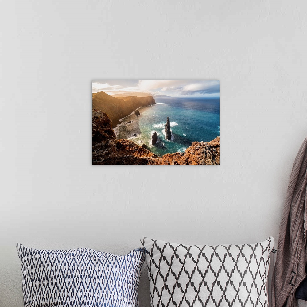 A bohemian room featuring The rocks, the sea and the cliff at sunset above the miradouro do San Lourenco, Madeira Island, P...