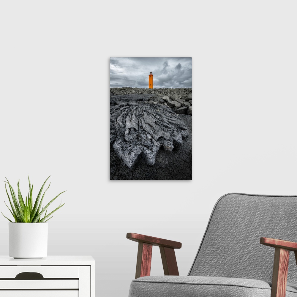 A modern room featuring Selvogsviti Lighthouse and ancient lava flow, Strandakirkja, Iceland