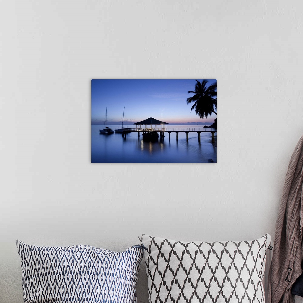 A bohemian room featuring Seychelles, Praslin Island, Anse Bois de Rose, pier at the Coco de Mer hotel, sunset