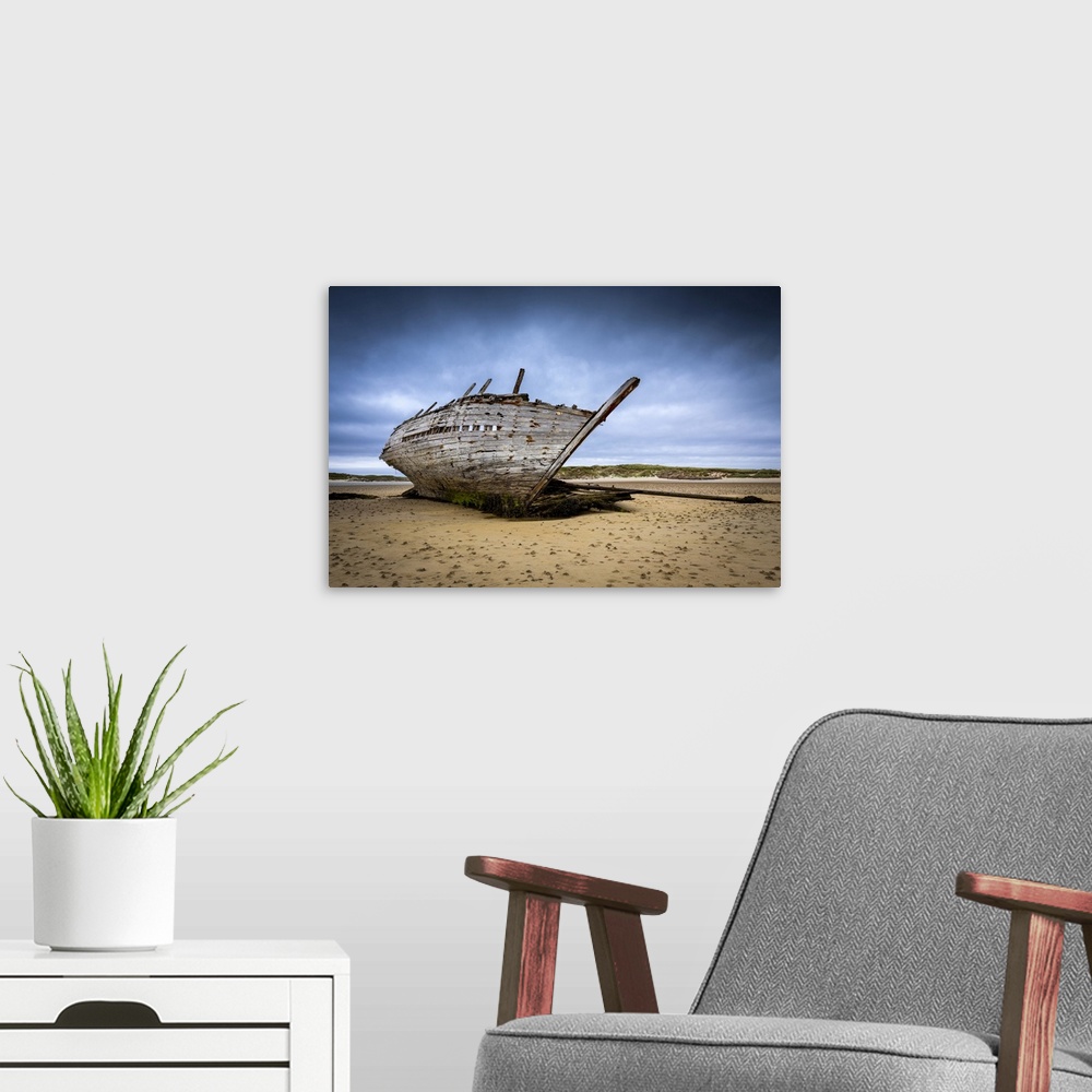 A modern room featuring Shipwreck at low tide on Magheraclogher beach. An Bun Beag, Bunbeg, County Donegal, Ulster region...
