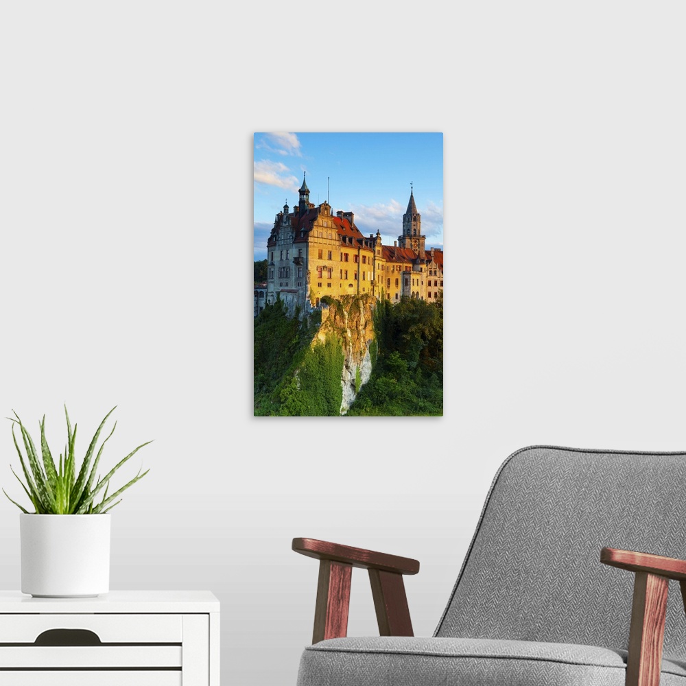 A modern room featuring Elevated view towards Sigmaringen Castle illuminated at sunset, Swabia, Baden Wurttemberg, German...
