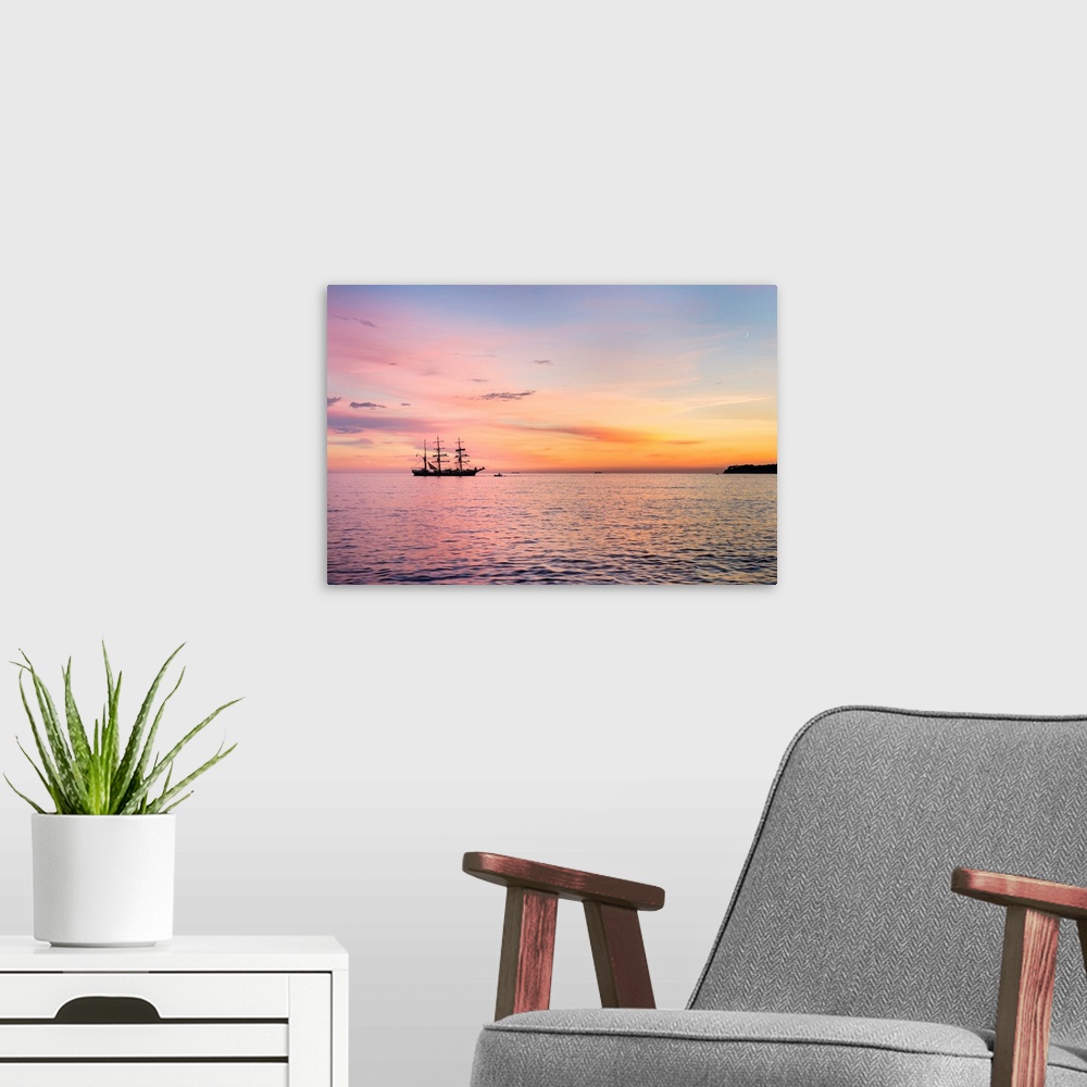A modern room featuring Silhouette of sailing ship at sunset off the coast of Cassis, Bouches-du-Rhone, Provence-Alpes-Co...