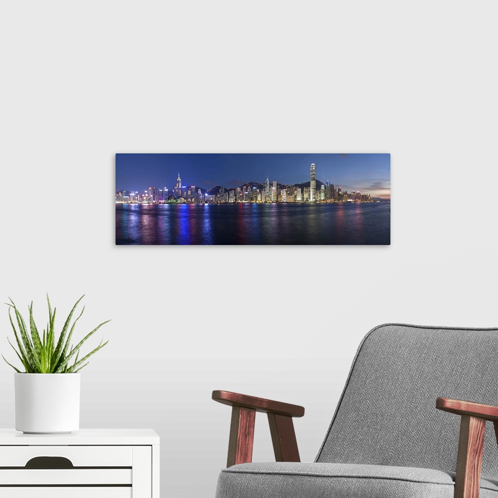 A modern room featuring Skyline of Central, Hong Kong Island, from Victoria Harbour, Hong Kong, China, Asia
