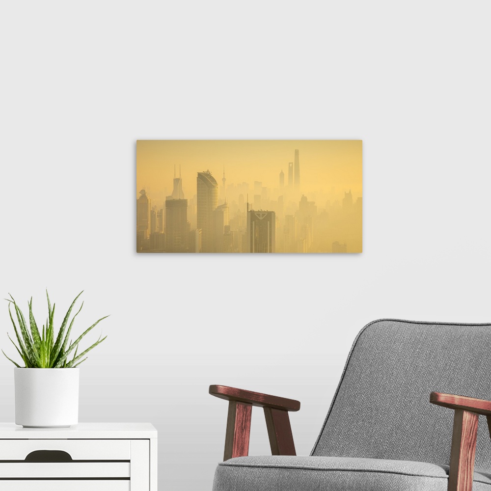 A modern room featuring Skyline of Shanghai from Jing'An on a foggy November morning, China.