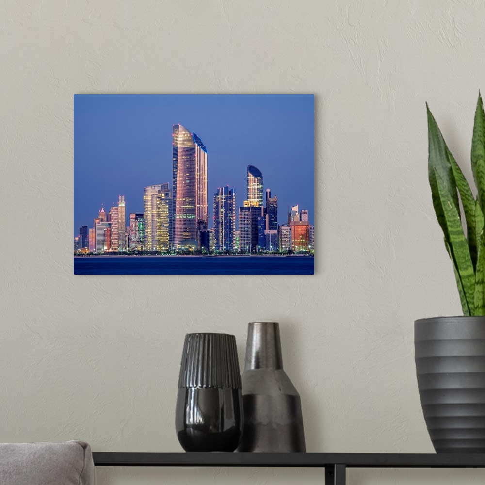 A modern room featuring Skyline Of The City Center At Twilight, Abu Dhabi, United Arab Emirates