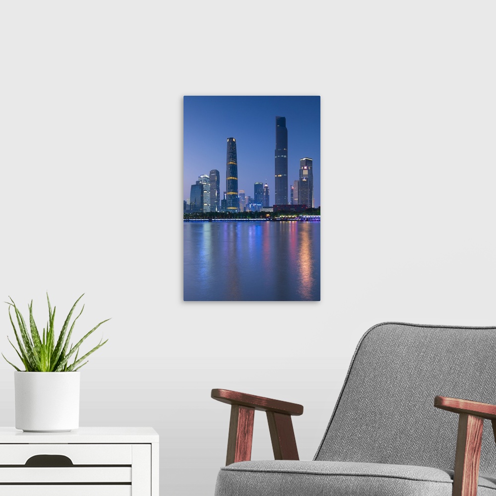 A modern room featuring Skyline of Tianhe at dusk, Guangzhou, Guangdong, China.