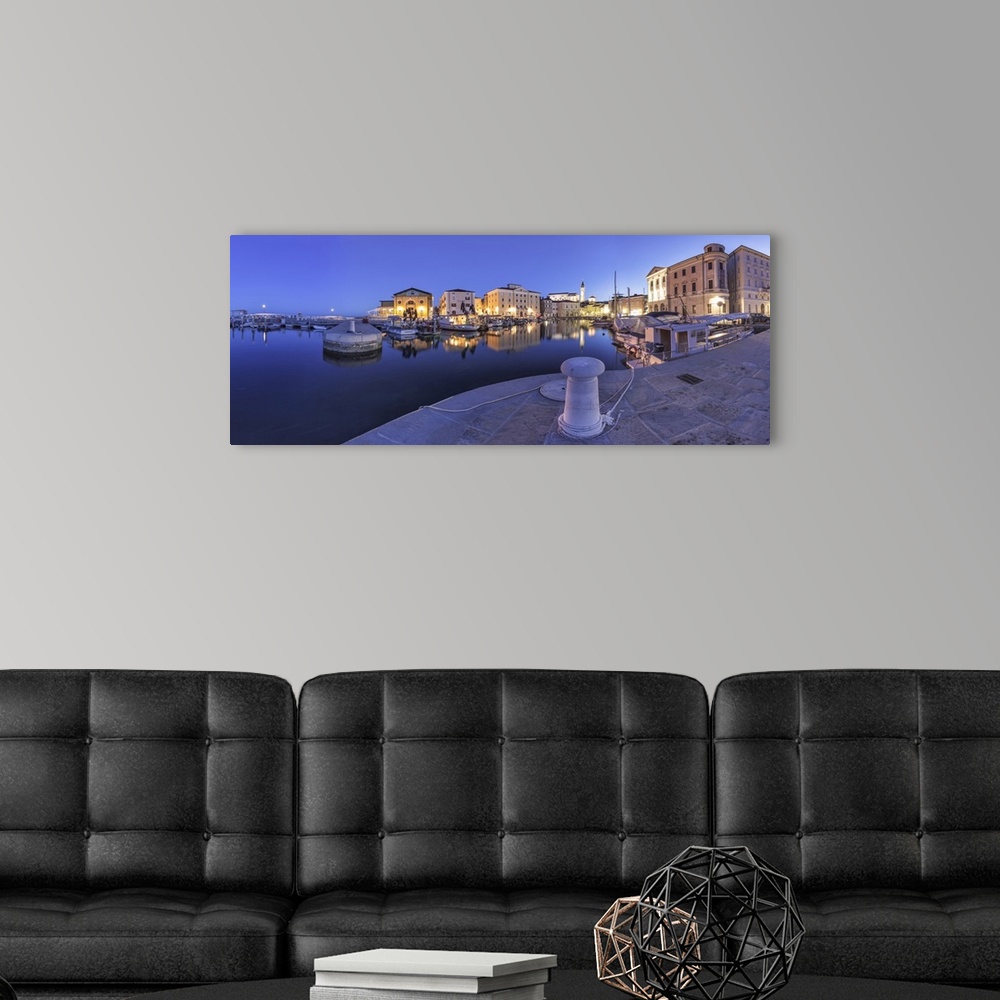 A modern room featuring Europe, Slovenia, Istria, Piran. The picturesque port and the buildings around it at dusk