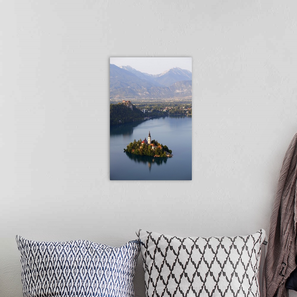 A bohemian room featuring Slovenia, Julian Alps, Upper Carniola, Lake Bled. Aerial view of the island on Lake Bled.