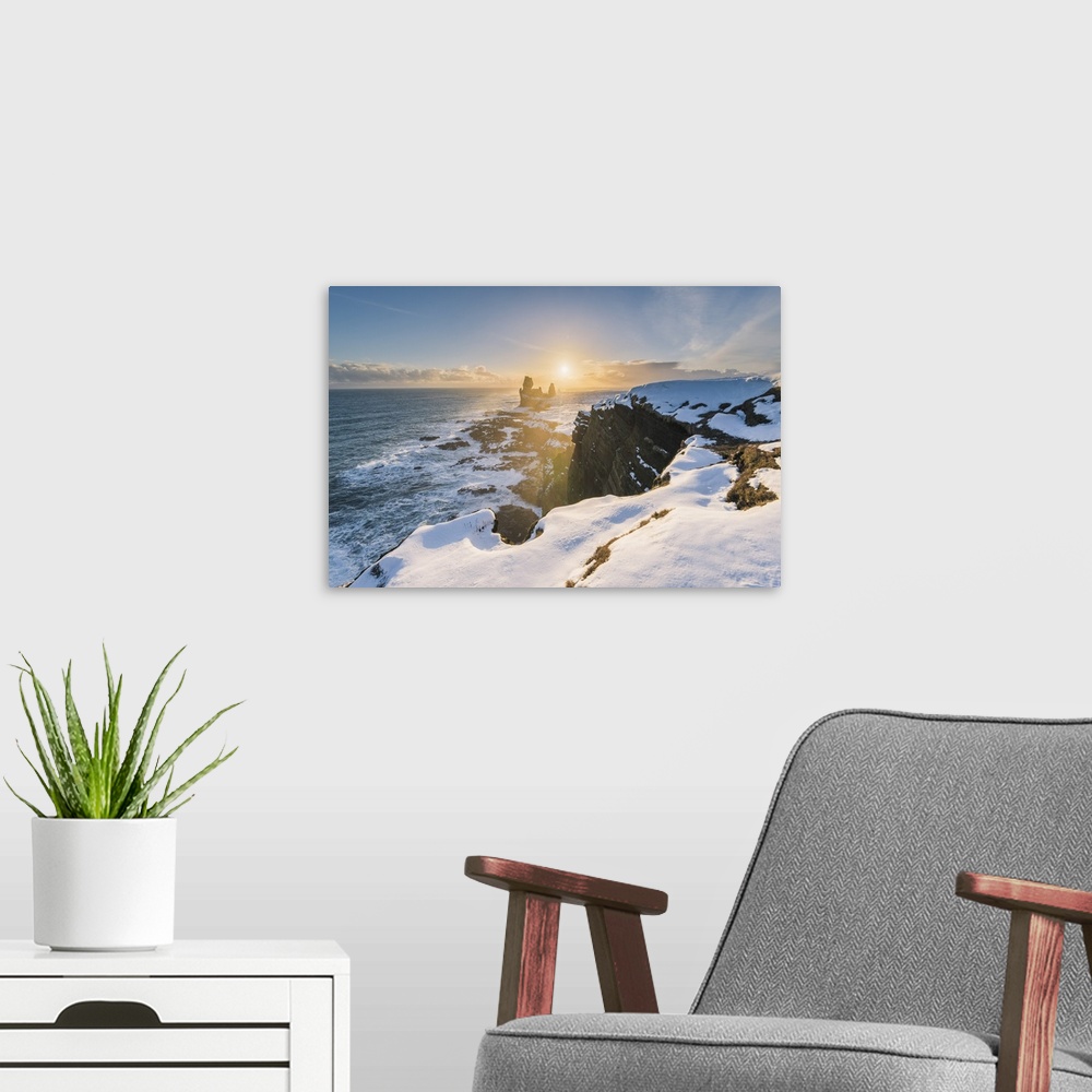 A modern room featuring Snaefellsnes Peninsula, Western Iceland, Iceland. Londrangar sea stack and coastal cliffs at sunset.