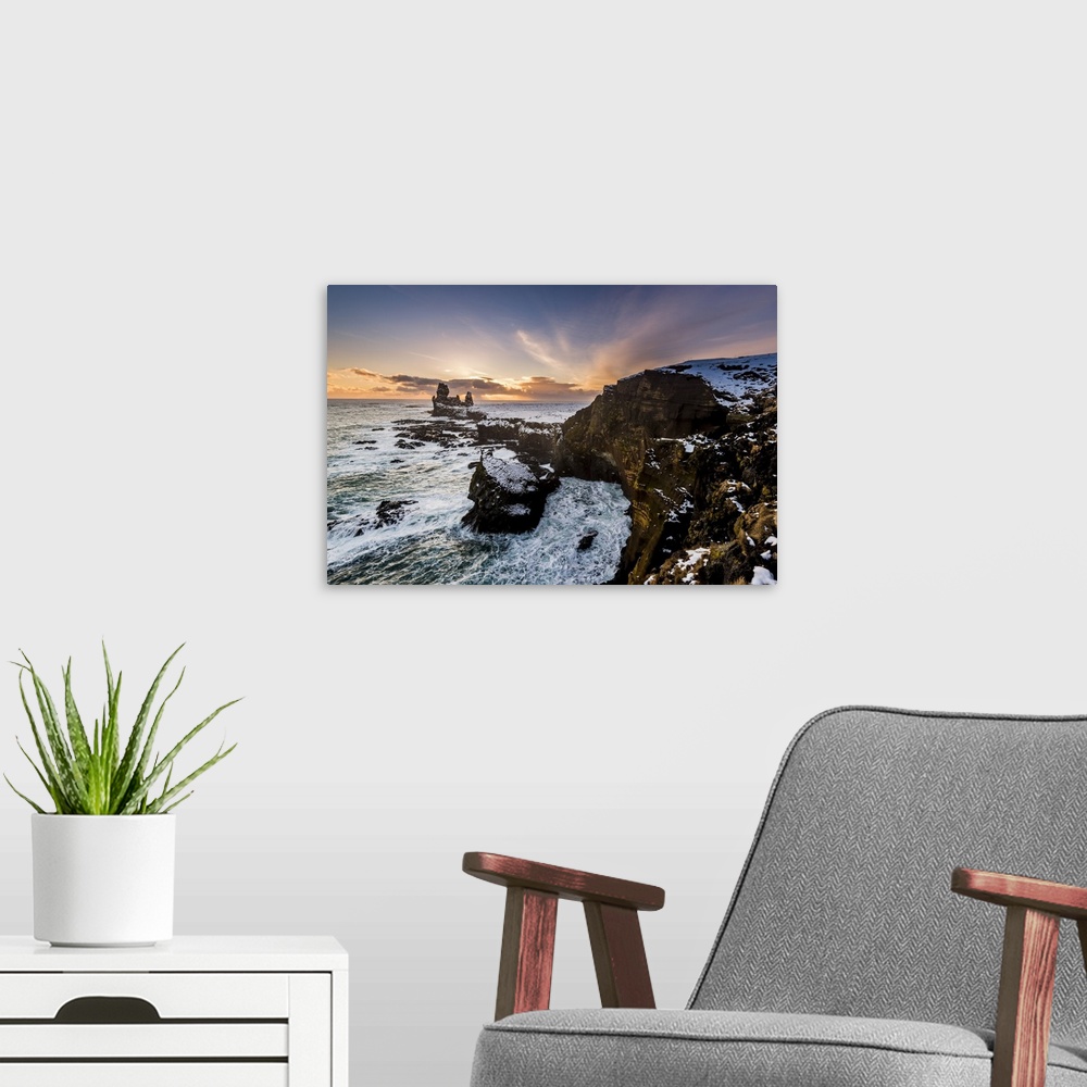 A modern room featuring Snaefellsnes Peninsula, Western Iceland, Iceland. Londrangar sea stack and coastal cliffs at sunset.