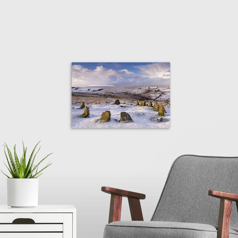 A modern room featuring Snow covered Nine Maidens cairn circle on Belstone Common, Dartmoor, Devon, England. Winter, Janu...