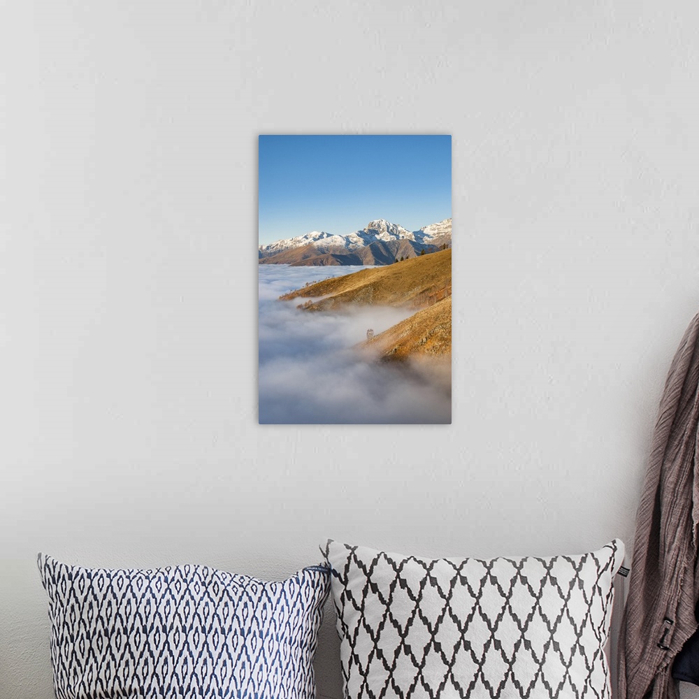 A bohemian room featuring Snowy mountains over the clouds (Bielmonte, Veglio, Biella province, Piedmont, Italy, Europe).