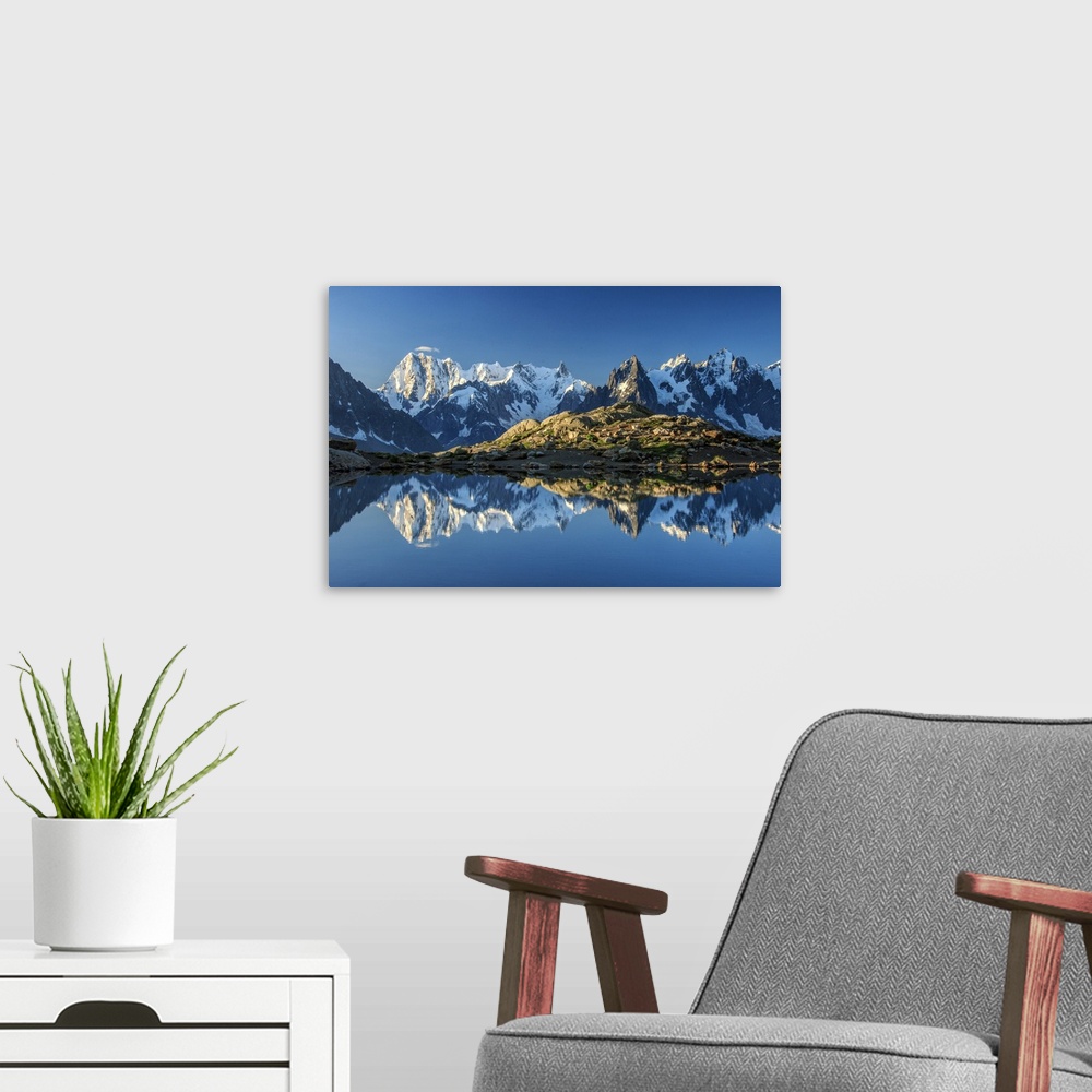 A modern room featuring Snowy peaks of Dent Du Geant and Grandes Jorasses are reflected in Lac Blanc, Haute Savoie, Franc...