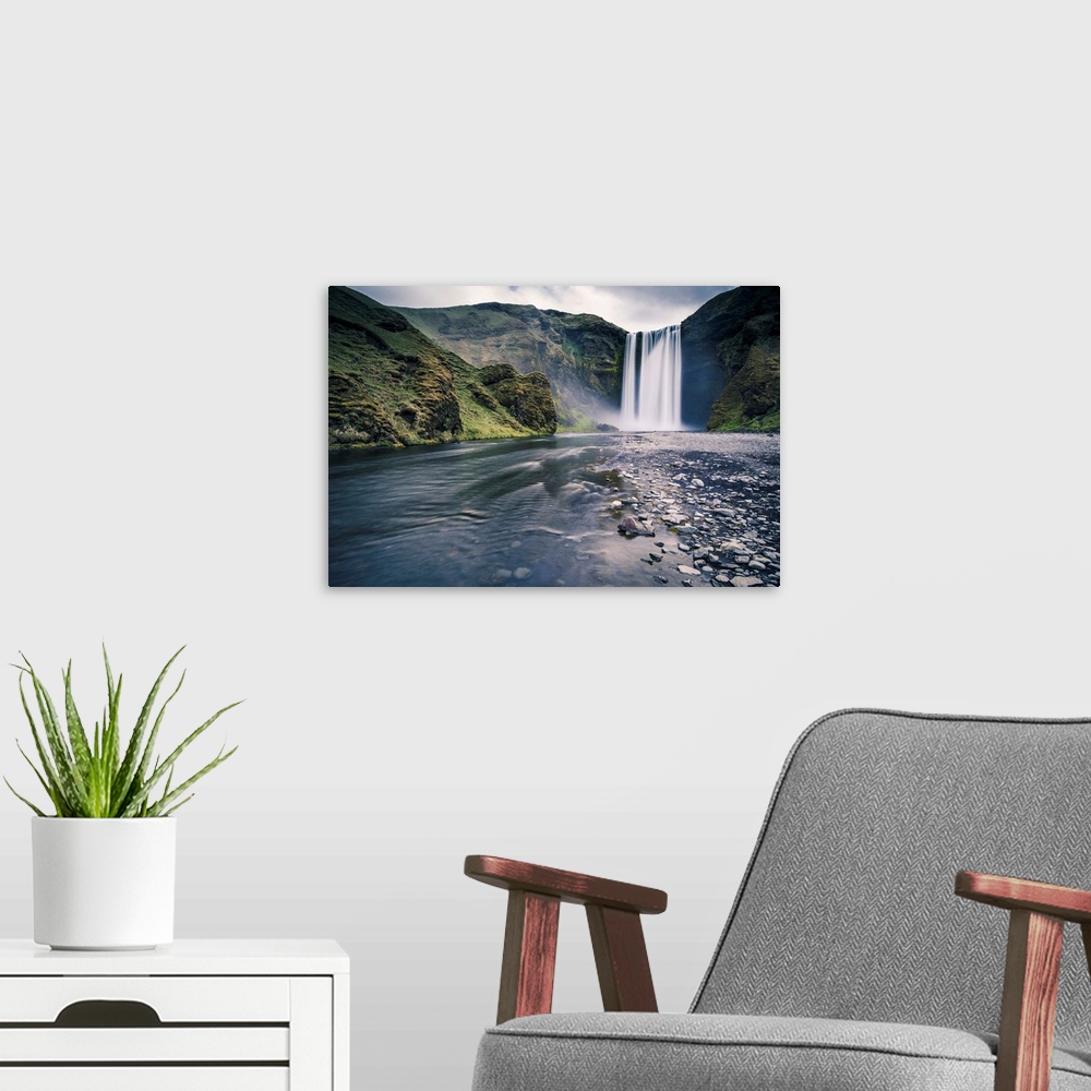 A modern room featuring Southern Iceland. Skogafoss waterfall.