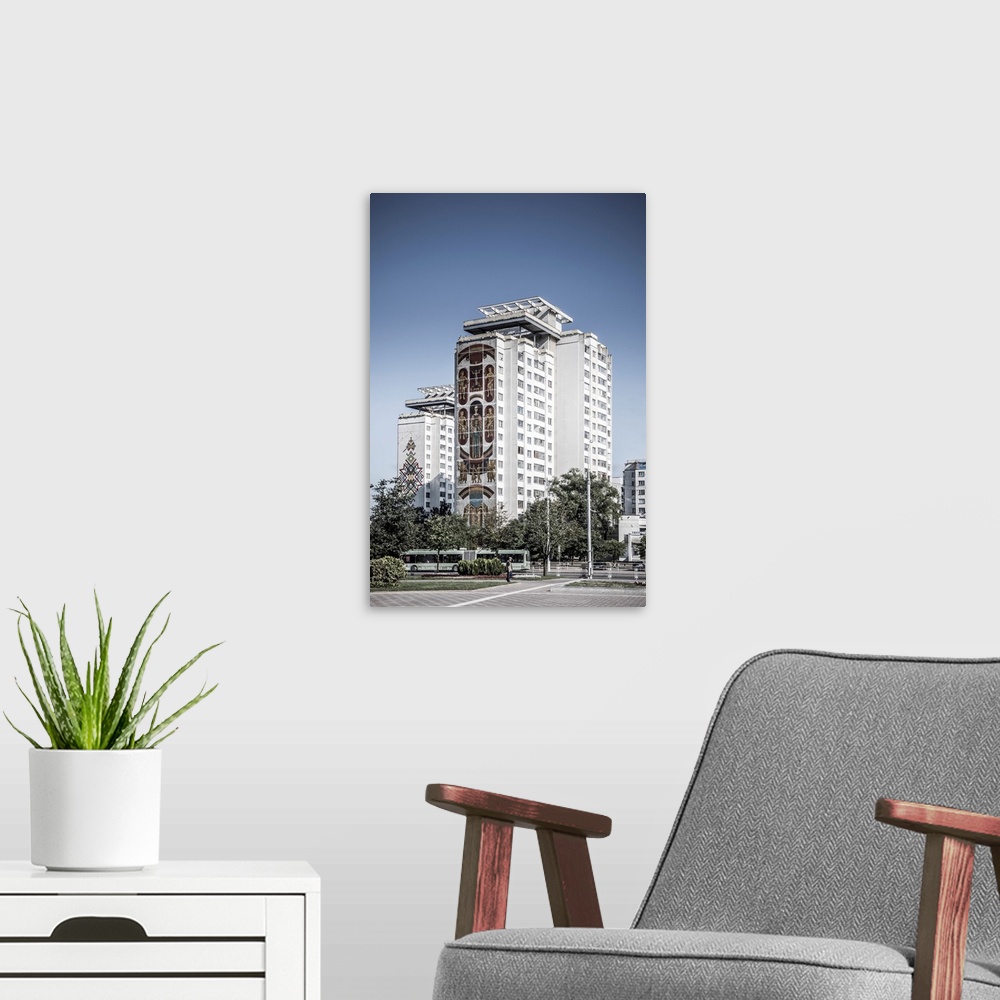 A modern room featuring Soviet wall murals on apartment building in Minsk, Belarus.