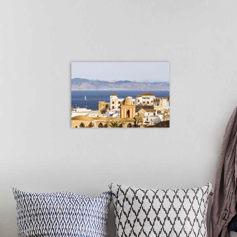 A bohemian room featuring Spain, Andalusia, Cadiz province, Tarifa. High angle view of the old town with the Straits of Gib...