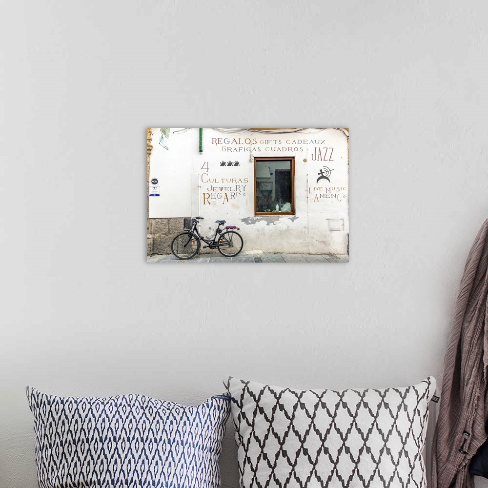 A bohemian room featuring Spain, Andalusia, Cordoba. Bicycle against a wall in the old town