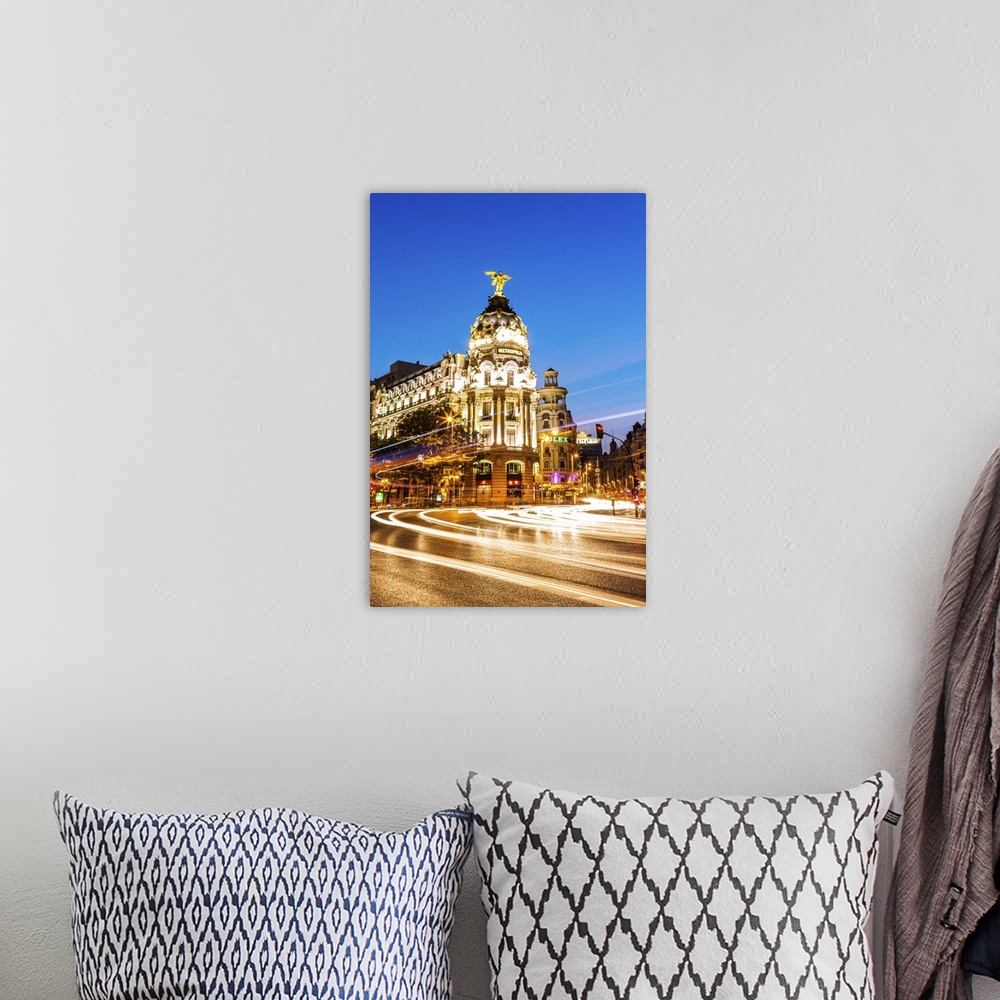 A bohemian room featuring Spain, Madrid. Cityscape at dusk with famous Metropolis building