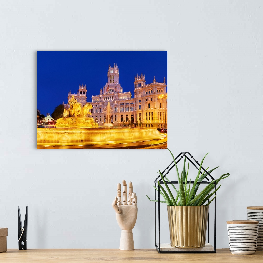 A bohemian room featuring Spain, Madrid. Plaza de Cibeles and town hall at night.