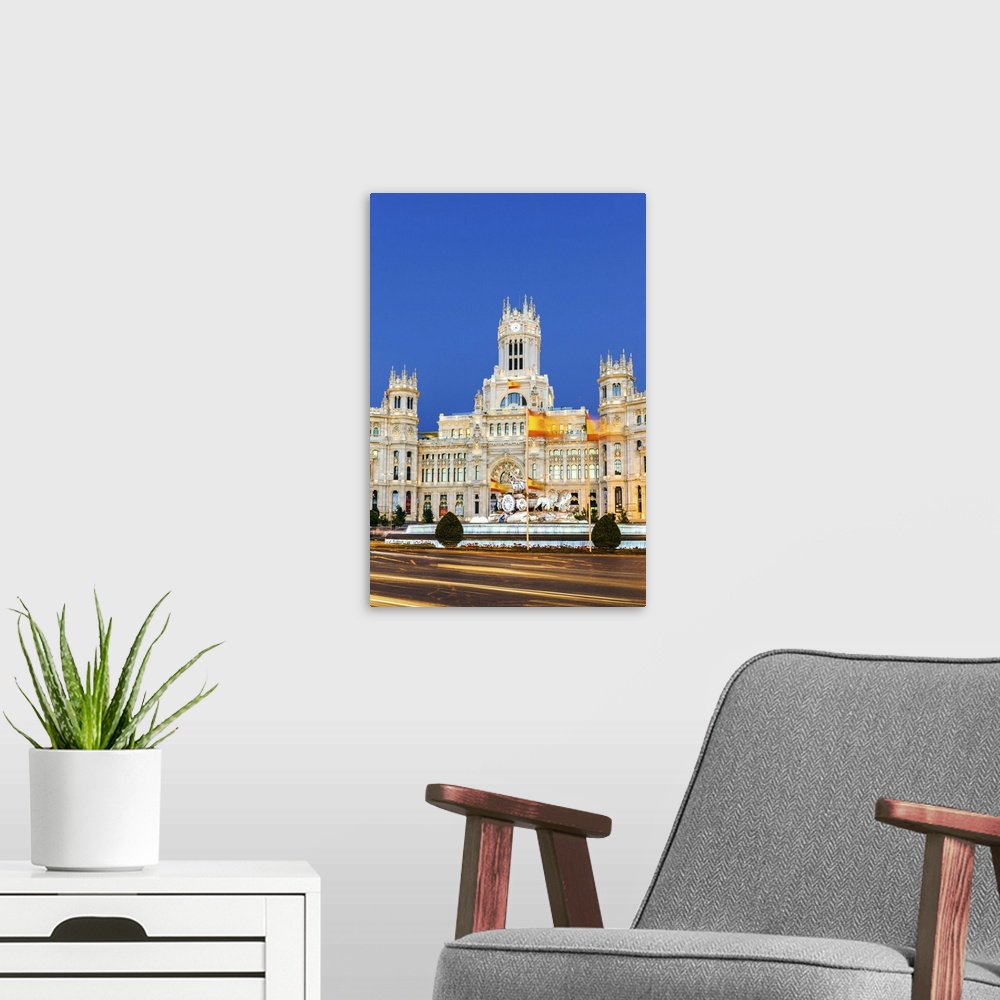 A modern room featuring Spain, Madrid. Plaza de Cibeles with famous fountain and town hall building behind
