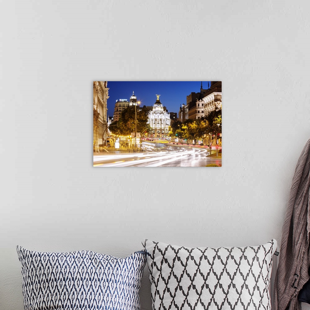 A bohemian room featuring Spain, Madrid. Street view with Metropolis building and light trails