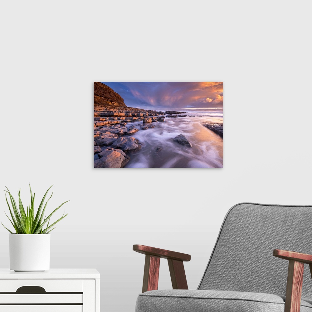 A modern room featuring Spectacular sunset over Nash Point on the Glamorgan Heritage Coast, South Wales, UK. Winter (Febr...