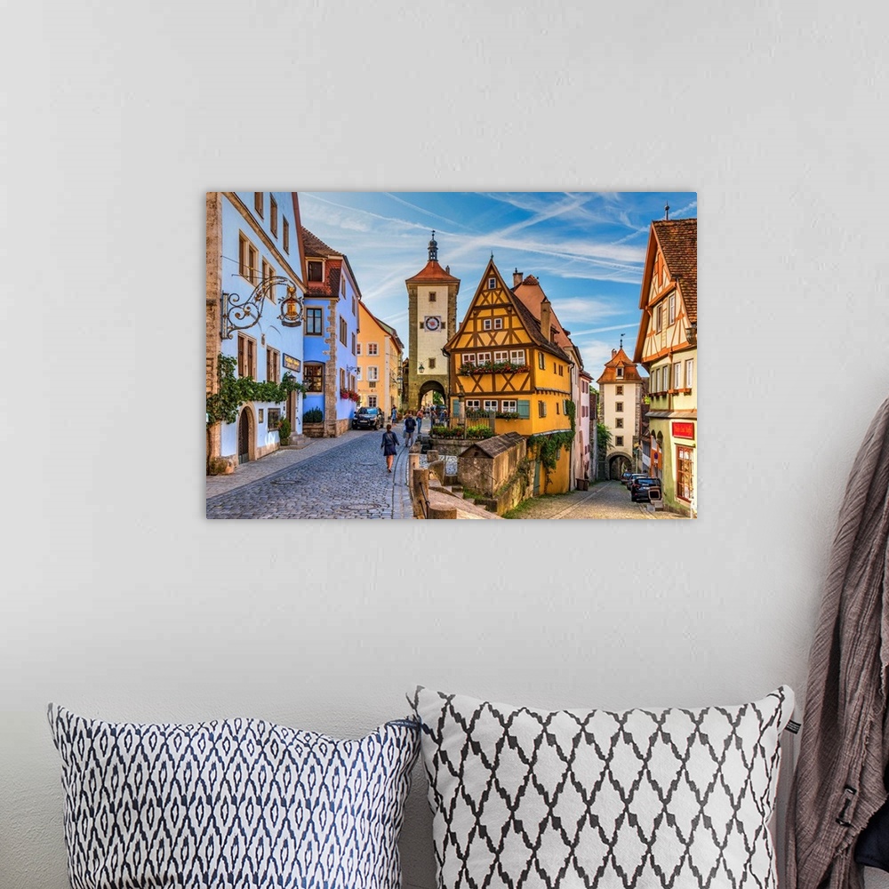 A bohemian room featuring Spitalgasse street with Plonlein half-timbered building in the middle and Siebers Tower on the le...