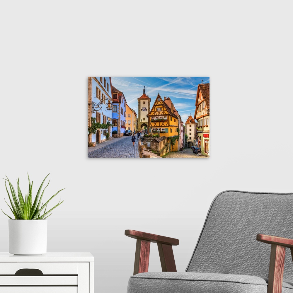 A modern room featuring Spitalgasse street with Plonlein half-timbered building in the middle and Siebers Tower on the le...