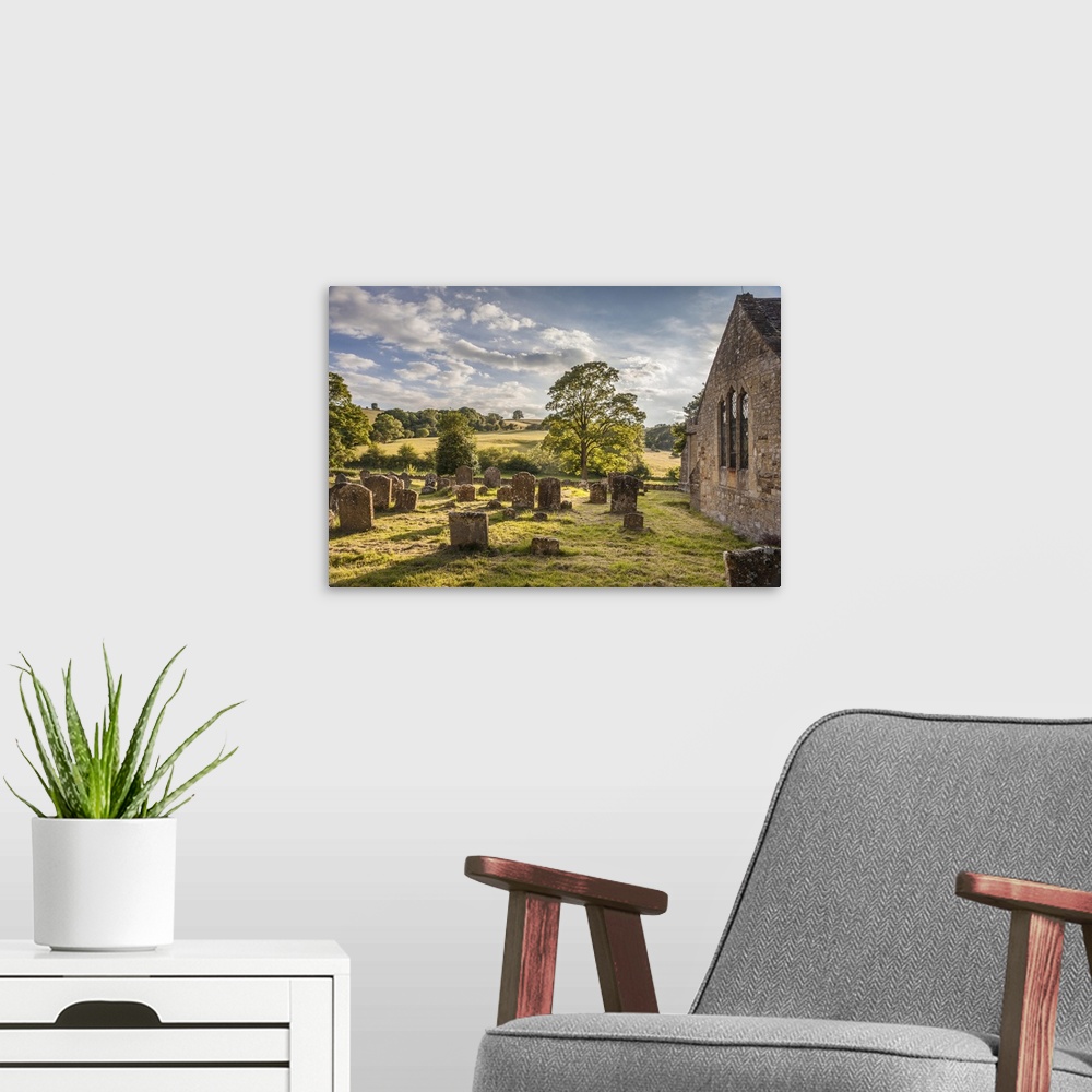 A modern room featuring St Eadburgha's Church graveyard at Broadway, Cotswolds, Gloucestershire, England.
