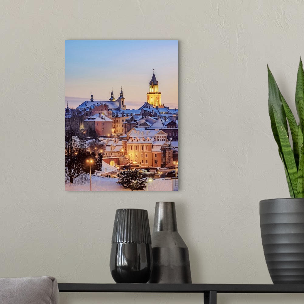 A modern room featuring Old Town Skyline featuring St John the Baptist Cathedral and Trinitarian Tower at dusk, winter, L...