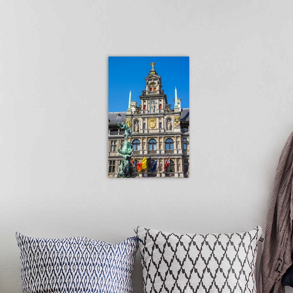 A bohemian room featuring Belgium, Flanders, Antwerp (Antwerpen). Stadhuis city hall and statue of Silvius Brabo on Grote M...