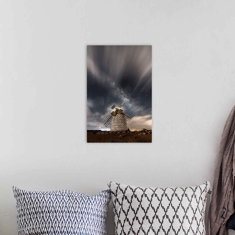 A bohemian room featuring Starry sky above the stone windmill, La Oliva, Fuerteventura, Canary Islands, Spain.