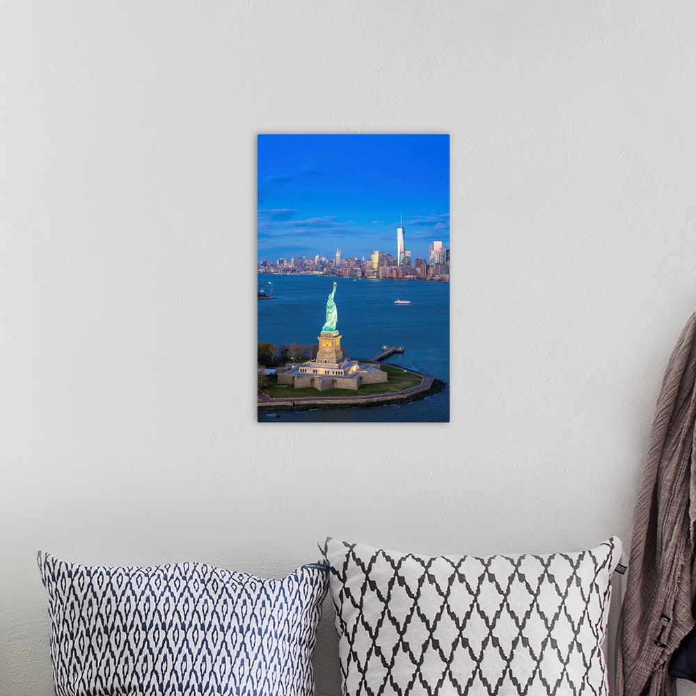 A bohemian room featuring Statue of Liberty and Lower Manhattan, New York City, New York, USA.