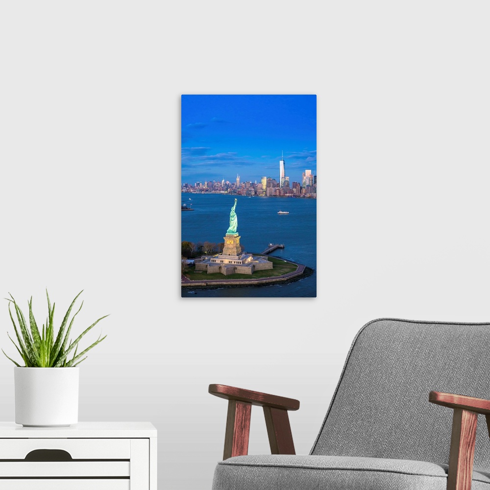 A modern room featuring Statue of Liberty and Lower Manhattan, New York City, New York, USA.